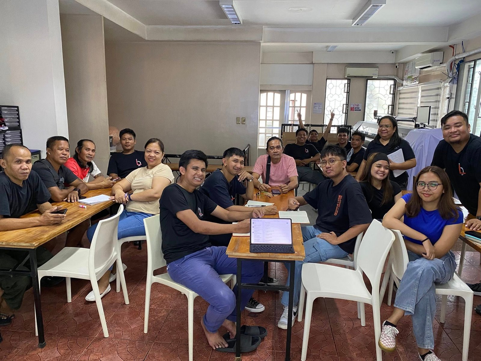 A smiling team member at their desk